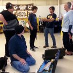 Ruell, staff and students and unpacking the instruments.